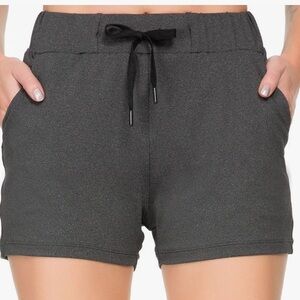 NWT Kcutteyg women’s running shorts, size small, gray. Elastic waist, pockets.